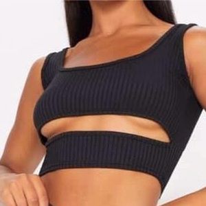 Under boob detail crop top in a black ribbed material. Very flattering from PLT.